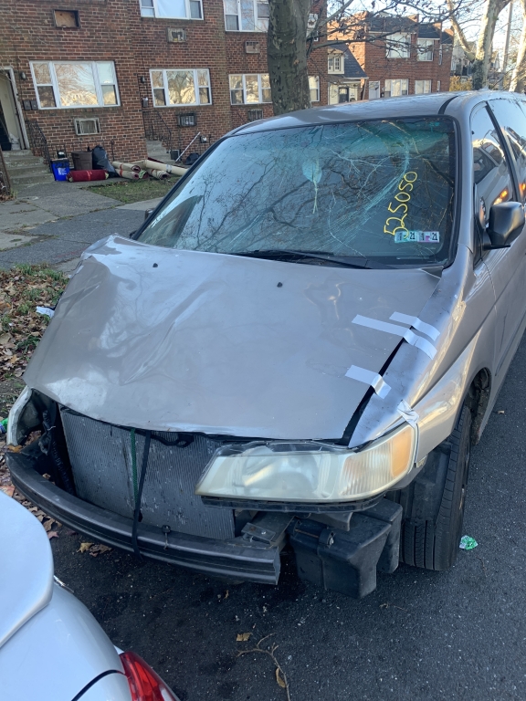 A badly damaged car fit to be sold to a junkyard